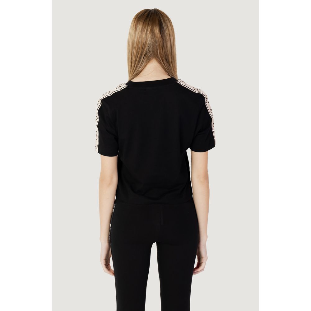 Back view of Guess Active Black Cotton T-Shirt on model, showcasing short sleeves and subtle design, perfect for casual style.