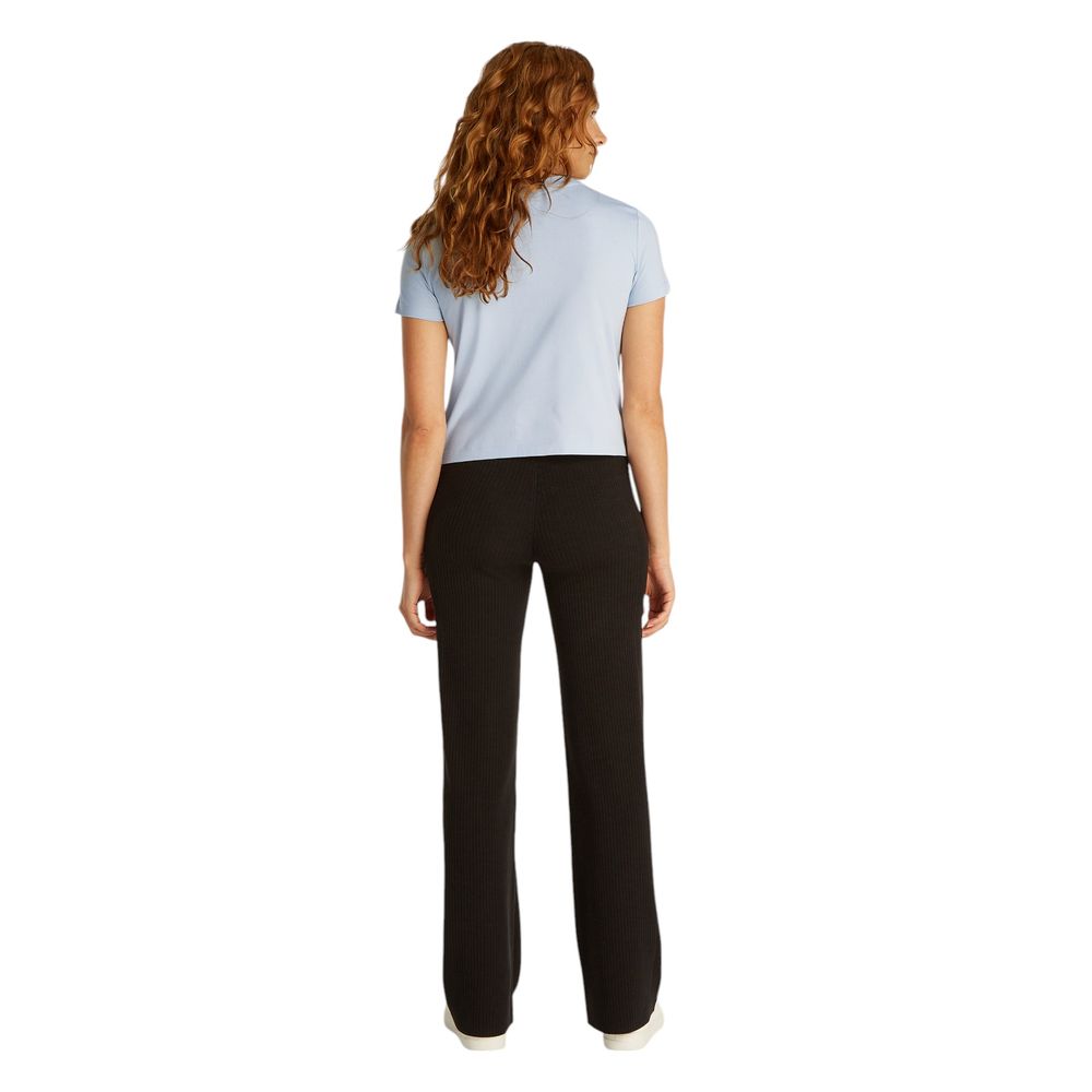 Back view of a woman wearing Calvin Klein Jeans Blue Recycled Cotton T-Shirt, showcasing the style and fit of the sustainable fabric.