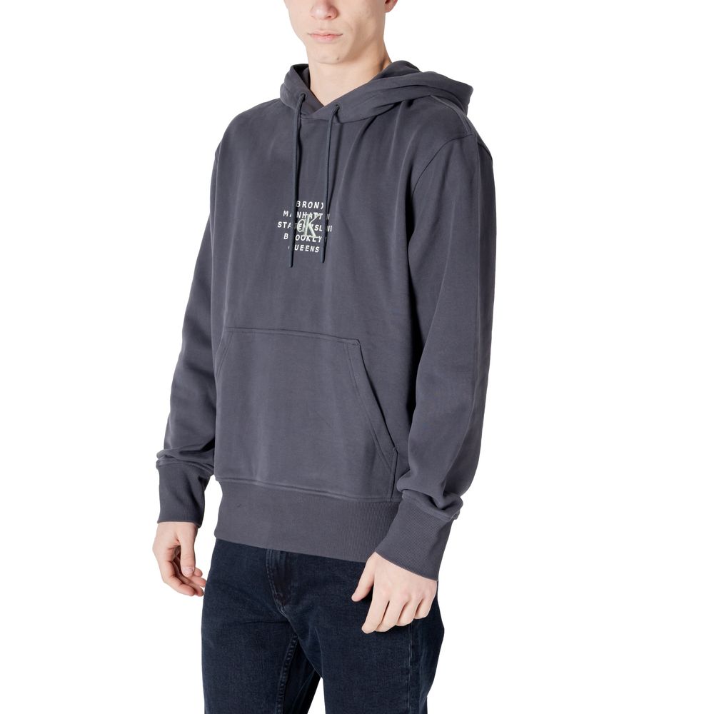 Man wearing Calvin Klein Jeans Gray Cotton Hoody with printed NYC graphic, showcasing urban style and comfort, perfect for casual wear.