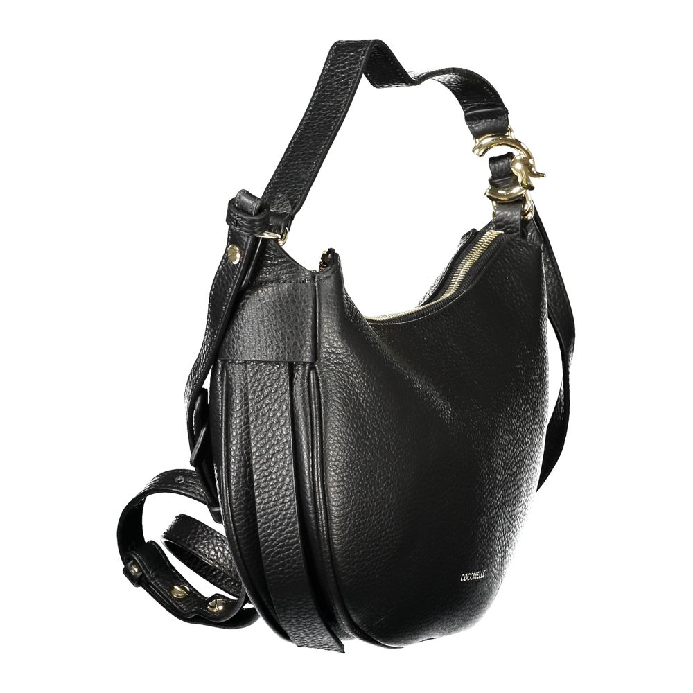 Coccinelle Black Leather Handbag with adjustable strap, 3 internal pockets, featuring zip and magnet closure.