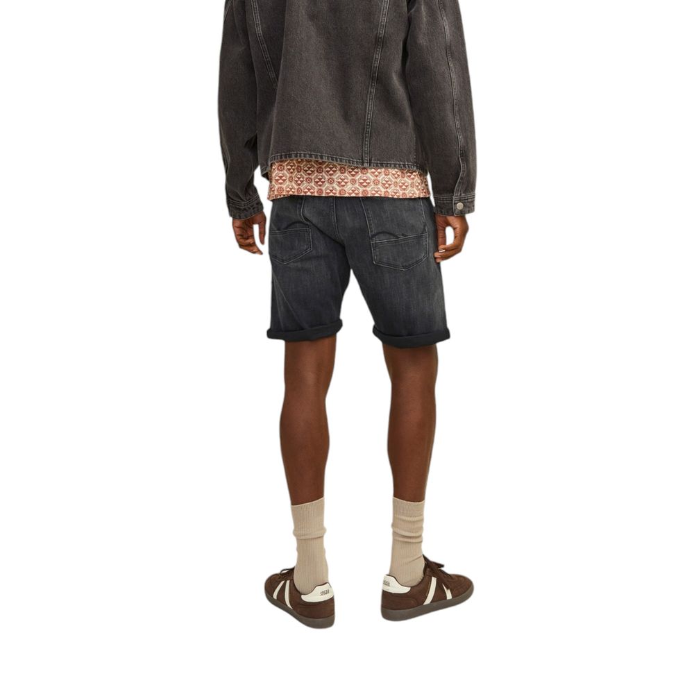 Model wearing Jack Jones Black Cotton Bermuda Shorts, showcasing a contemporary style for casual warm weather.
