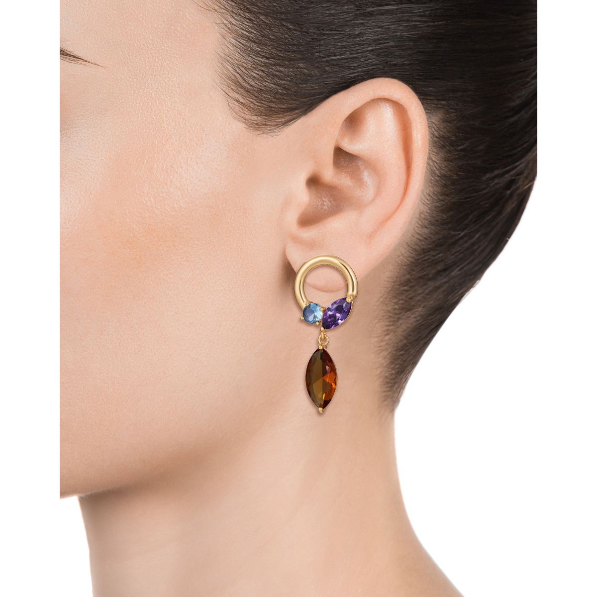Elegant model wearing colorful gemstone drop earrings with a gold hoop design.