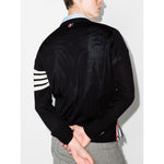 Back view of Thom Browne Sweaters Blue featuring signature 4-Bar stripe and button fastening in wool material.