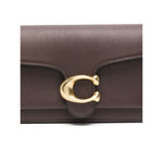 Coach Tabby 26 leather shoulder bag in earth brown with pebbled texture and gold logo plaque.