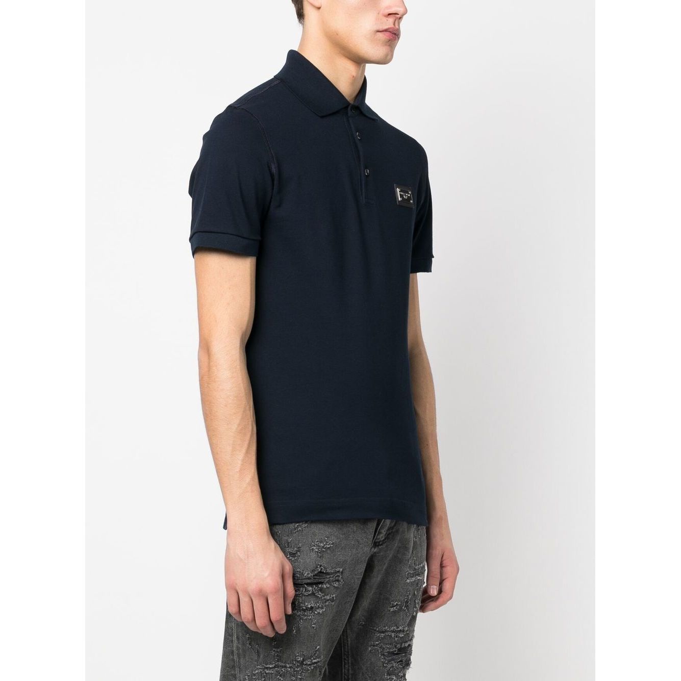 Dolce & Gabbana Logo cotton polo shirt in navy blue with ribbed trim and logo patch, featuring a polo collar and short sleeves.