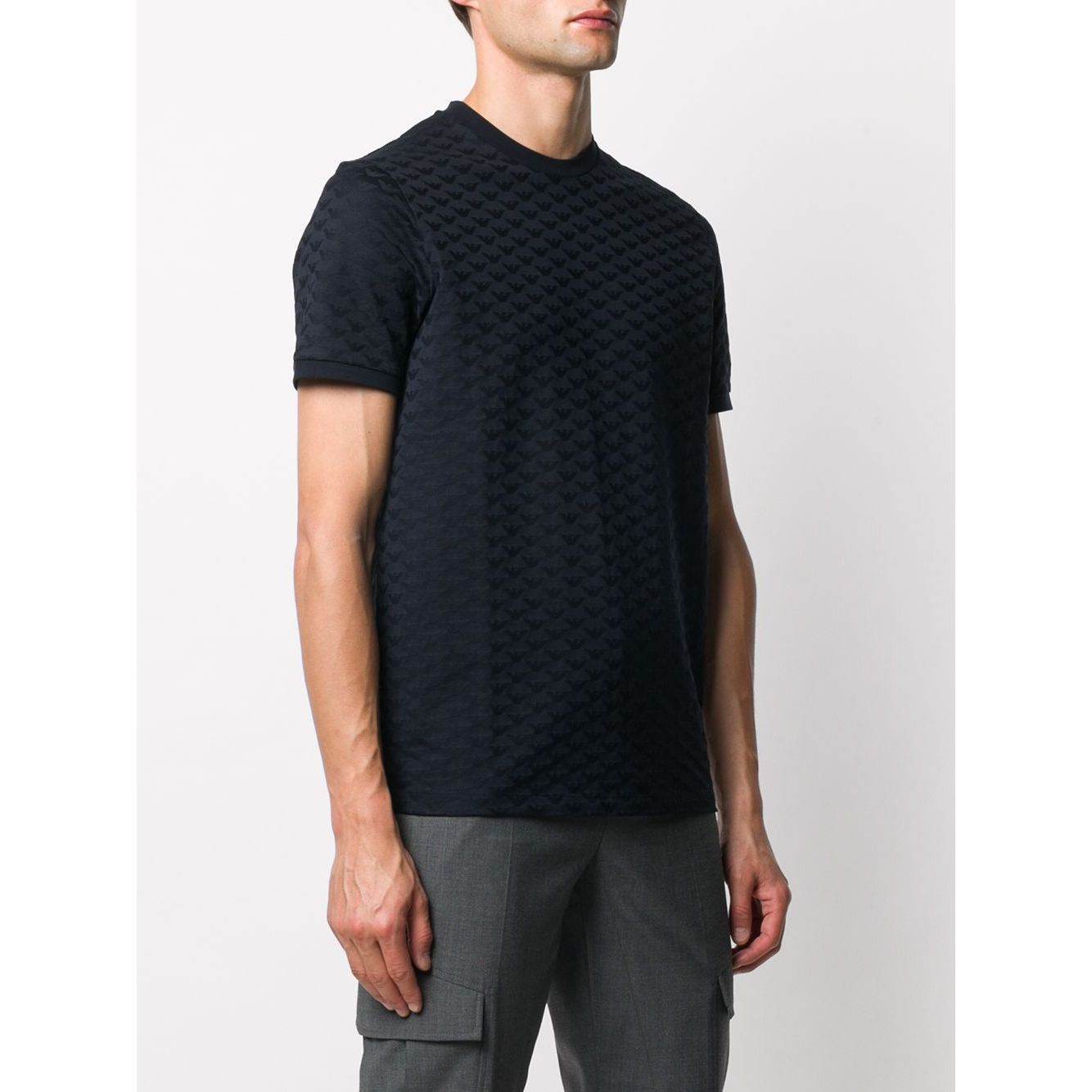 Man wearing Emporio Armani T-shirts and Polos Blue with embossed logo pattern, navy blue cotton, crew neck, short sleeves, straight hem.