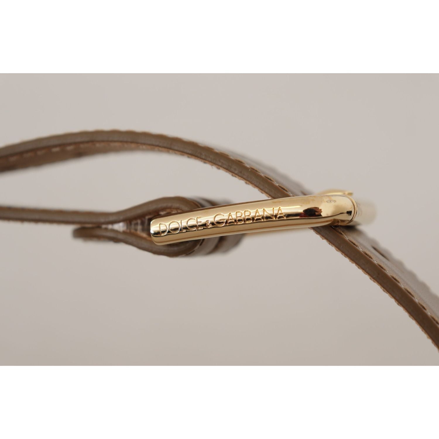 حزام دولتشي آند غابانا الجلدي البرونزي بإبزيم ذهبي اللون