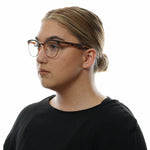 Police Brown Women Glasses Frame on woman with black shirt, side view, showcasing full-rim butterfly style in brown plastic material.