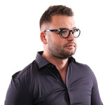 Man wearing Lozza Black Unisex Glasses Frame, side view, showcasing full-rim black plastic frame, suitable for both genders.