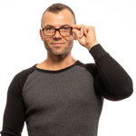 Man wearing Zadig & Voltaire Brown Men Glasses Frame with a plastic full-rim rectangular design.