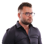 Man wearing Hackett Blue Men Glasses Frame with round lenses and blue metal-plastic frame, featuring full-rim style.