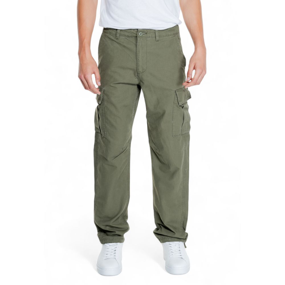 Man wearing Jack Jones Green Cotton Cargo Pants with side pockets and tapered fit for comfort and style, showcasing modern design.