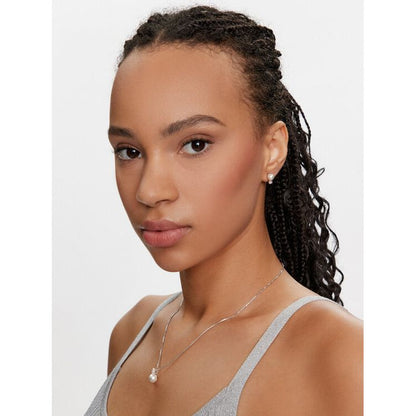 Woman wearing SWAROVSKI Mod. 5689624 earrings, shown in profile, styled with silver 925° material, perfect for elegant occasions.