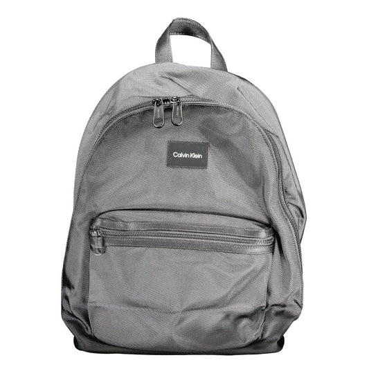 Calvin Klein Black Polyester Backpack with adjustable straps, external and internal pockets, laptop compartment, and water-repellent finish.