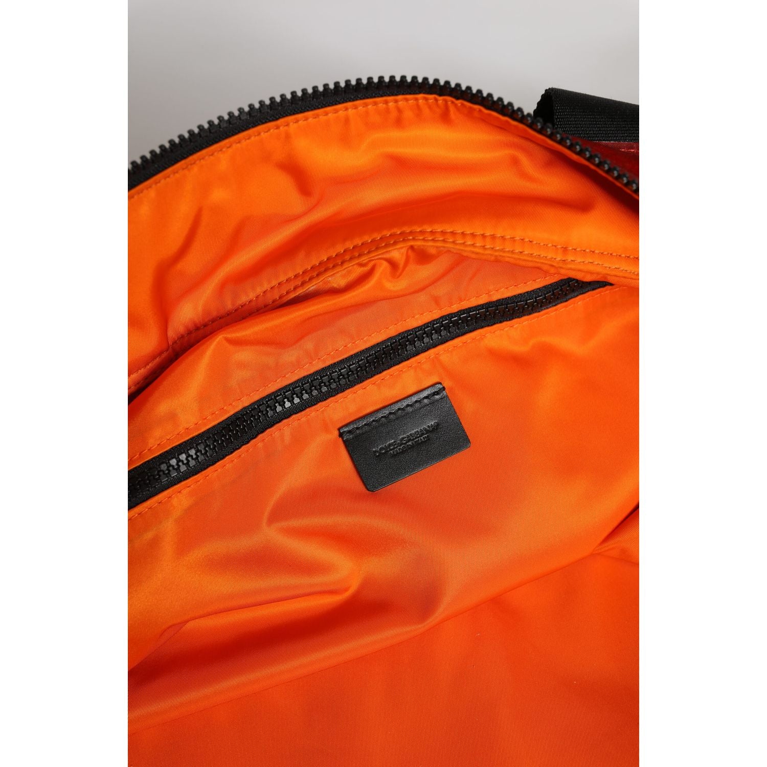 Front view with bag zipped and handles upright.