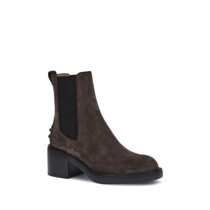 Tod's Brown Calf Leather Bos Taurus Ankle Boots with elastic sides and embossed monogram, featuring a rubber lug sole and block heel.