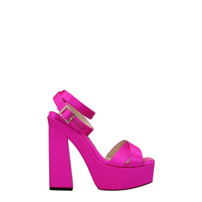 Jimmy Choo Pink Satin Platform Sandals with buckle closure, high heel, and open toe design in fuchsia color.