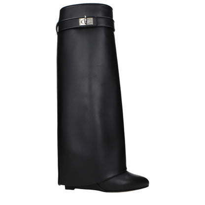 Givenchy Black Leather Boots with turn lock closure, side logo, pointy toe, wedge heel, and leather sole. SKU: BE08905004001.