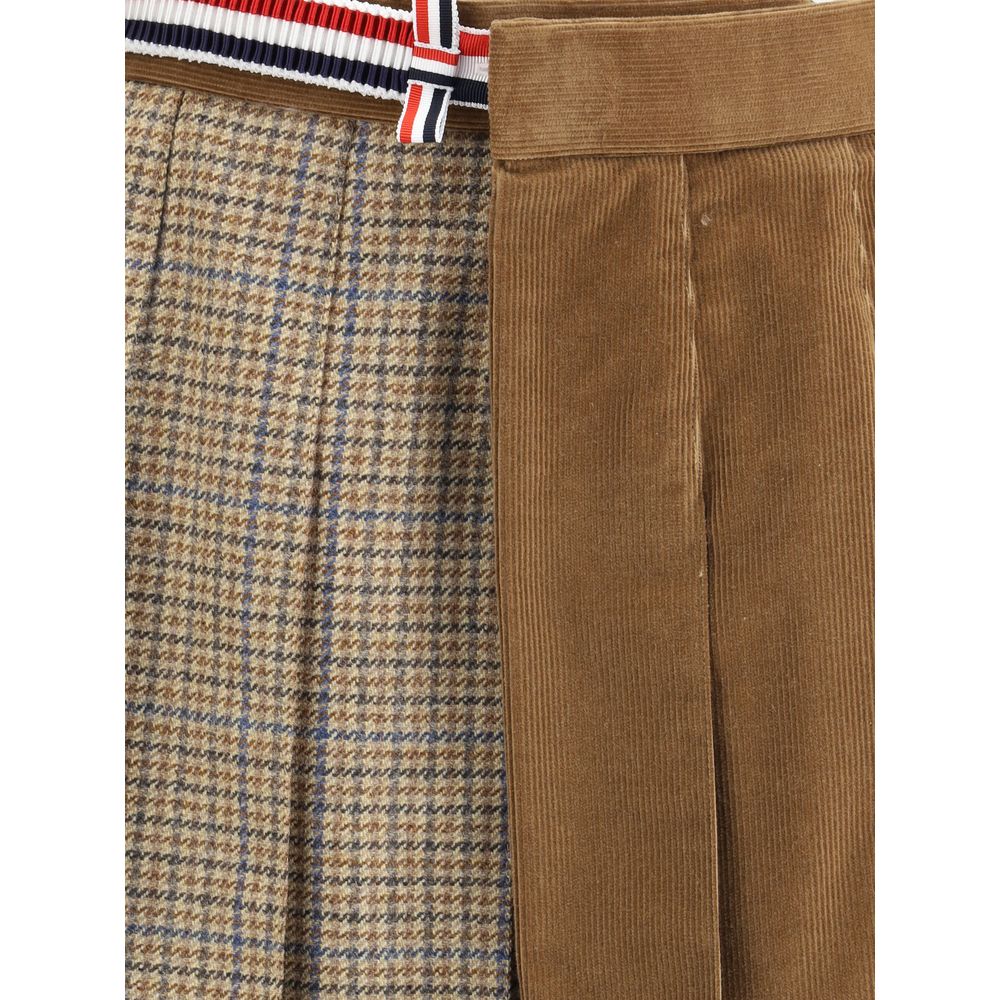 Thom Browne Brown Wool Mini Skirt with houndstooth and velvet layers, striped side band, pleats, and button closure details.