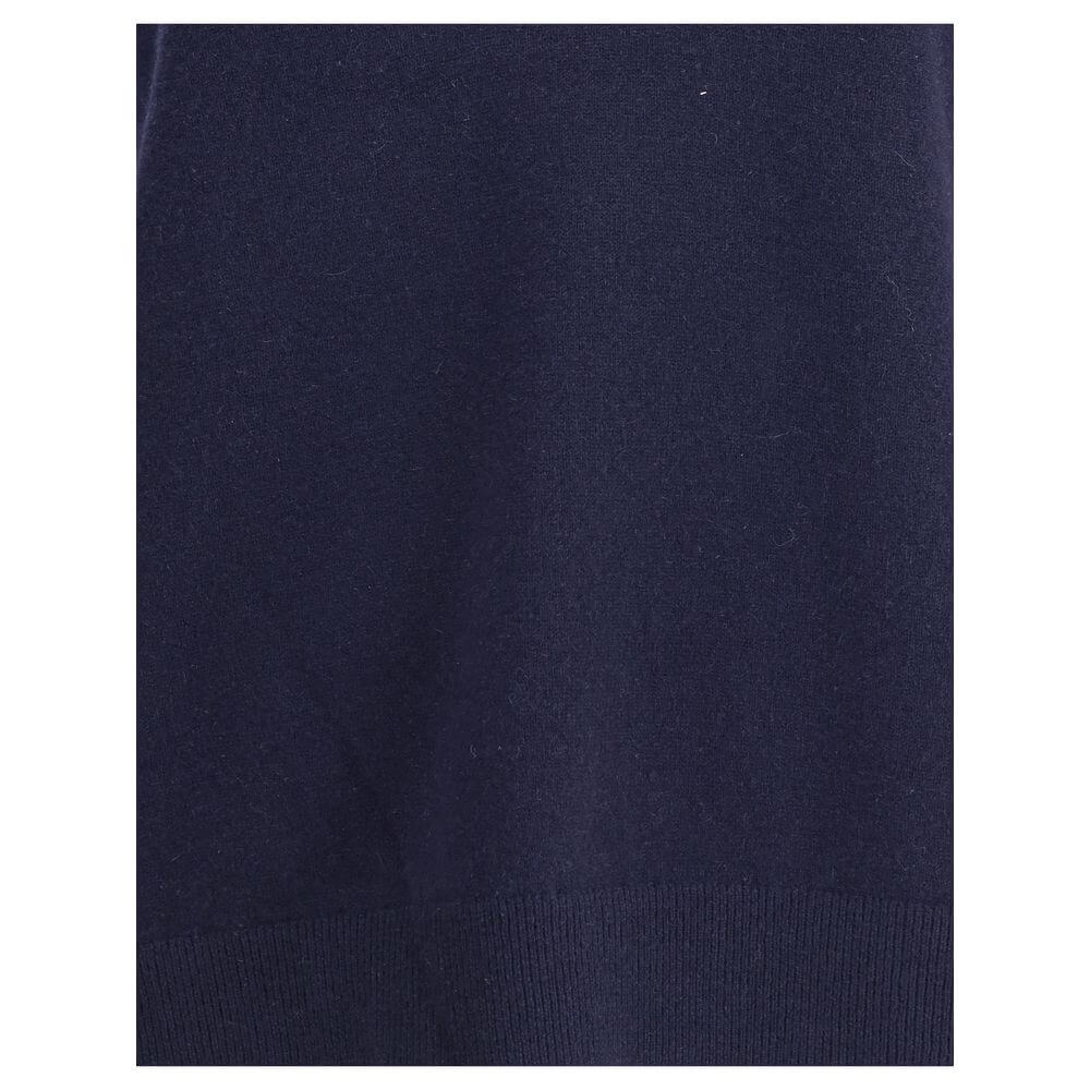 Extreme Cashmere Blue Cashmere Sleeveles Sweater showing deep ribbed hem detail for versatility and sophistication.