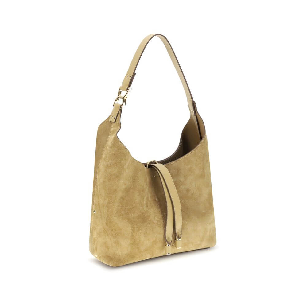 Alt Tag: Chloé Beige Calf Leather Bos Taurus Shoulder Bag featuring a suede finish, tasseled closure, and golden metallic elements.