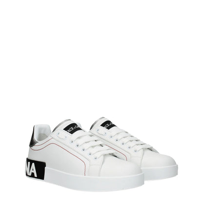 Dolce & Gabbana White Leather Low Top Sneakers with logo detail, sporty glam style, lace-up closure, and rubber sole.