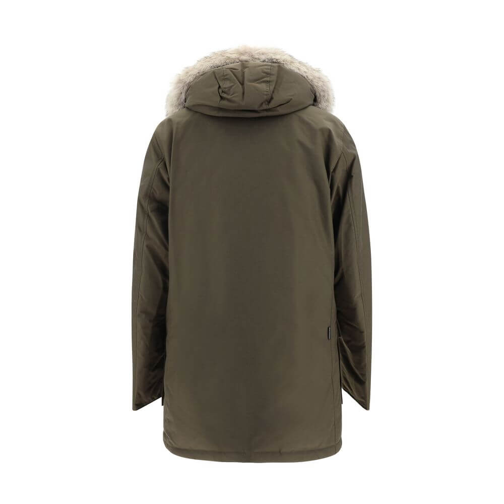 Back view of Woolrich Green Cotton Parka with fur-lined hood, showcasing padded oversize fit for AW25 season.