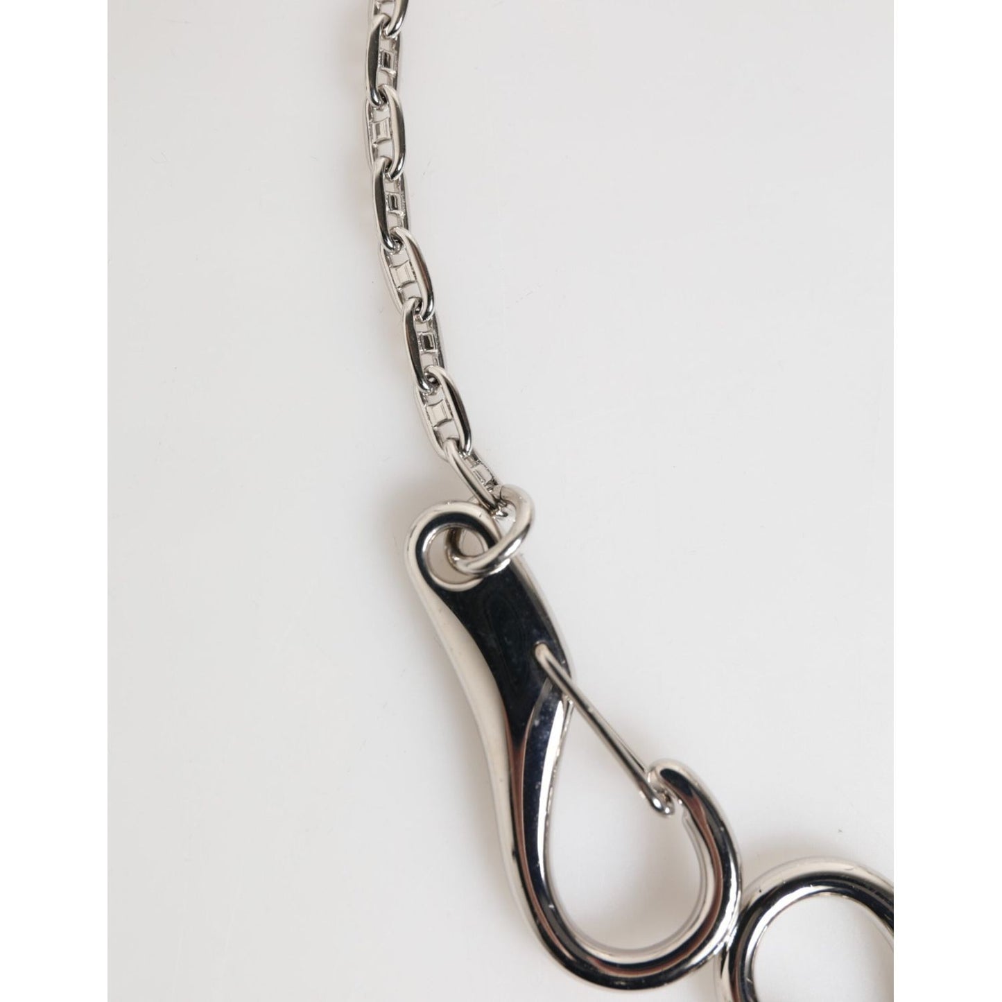 Close-up of Dolce & Gabbana Silver DG Logo Key Holder Keychain Bag Charm Keyring featuring a silver-tone lobster clasp on a chain.