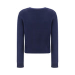 Lisa Yang Mable Sweater in blue cashmere with ribbed crew neck, cuffs, and hem, showcasing monochrome design. Ideal for elegant everyday wear.
