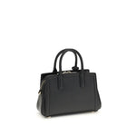 Michael Kors Laila Shoulder Bag with adjustable strap, top handle, and gold-tone details, featuring elegant and compact design for AW25 season.