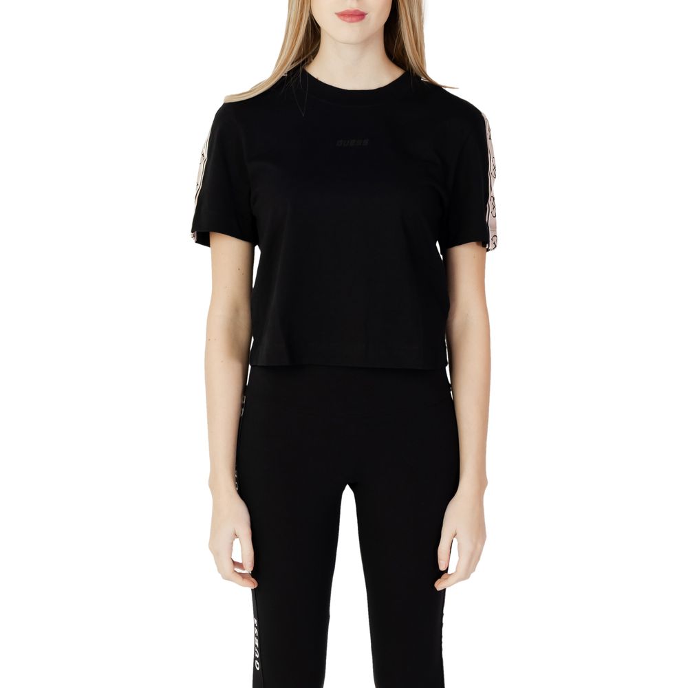 Guess Active Black Cotton T-Shirt featuring a cropped design, worn by a model with matching black leggings, front view.