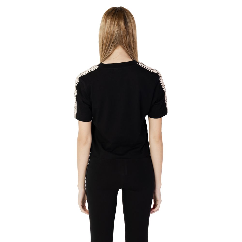 Back view of Guess Active Black Cotton T-Shirt on model, showcasing short sleeves and comfortable fit.