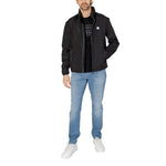 Armani Exchange Black Polyester Jackets & Coat on model, showcasing lightweight design with zip closure and reflective details.