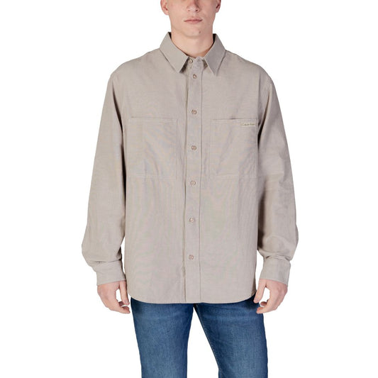 Man wearing Calvin Klein Jeans Beige Recycled Cotton Shirt with long sleeves and classic collar.