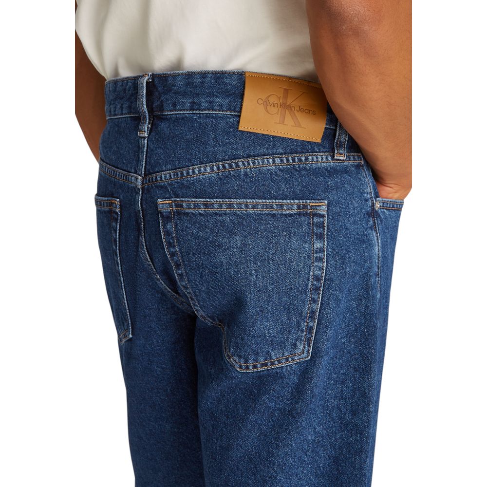 Back view of Calvin Klein Jeans Blue Cotton Bermuda Shorts with leather logo patch, showcasing denim texture and stitching details.