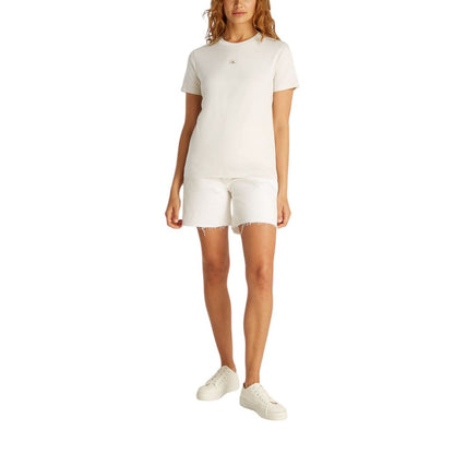 Calvin Klein Jeans Beige Recycled Cotton T-Shirt for women, featuring a short-sleeve design and iconic logo, paired with white shorts.