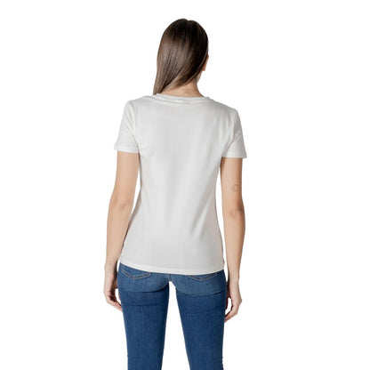 Back view of model wearing Guess Active White Cotton T-Shirt with jeans.