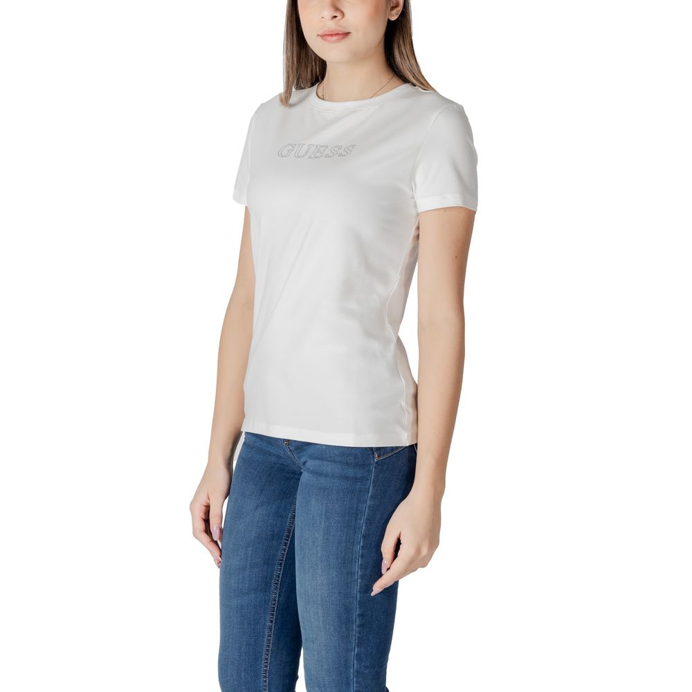 Woman wearing Guess Active White Cotton T-Shirt, featuring a simple design with Guess logo, paired with blue jeans.