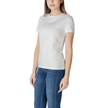 Woman wearing Guess Active White Cotton T-Shirt, featuring a simple design with Guess logo, paired with blue jeans.
