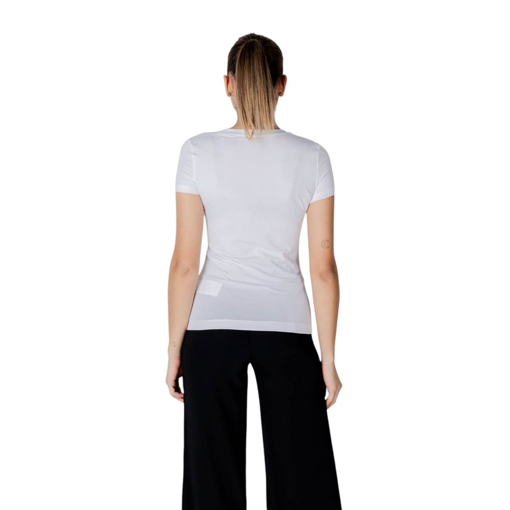 Back view of model wearing Guess White Cotton T-Shirt with slim fit and lace details.