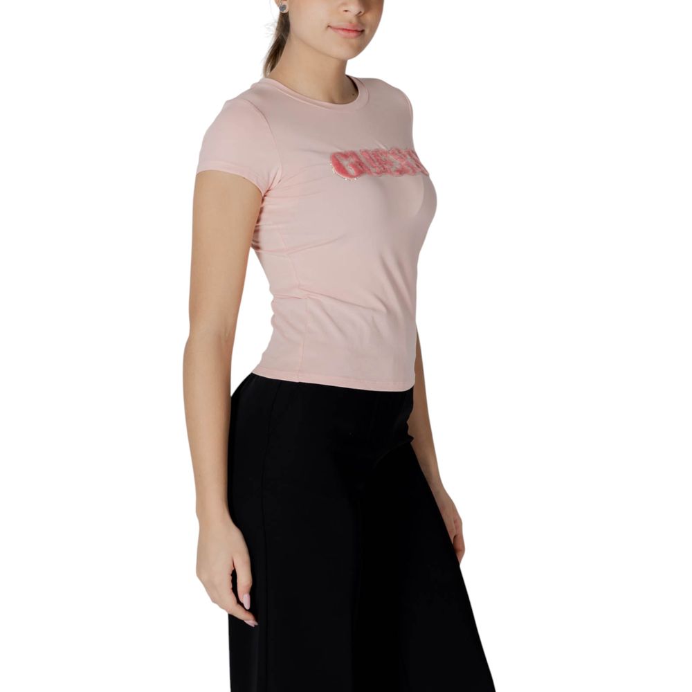 Guess Multicolor Cotton T-Shirt with pony hair logo, soft jersey fabric, modeled by woman with short sleeves, crew neck, pink color.