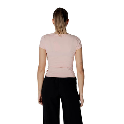 Back view of a woman wearing a Guess Multicolor Cotton T-Shirt showcasing short sleeves and a crew neck design.