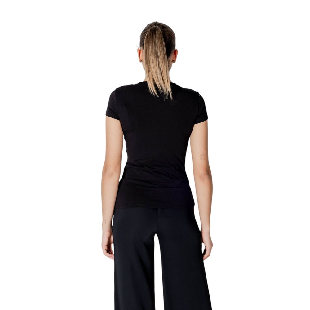 Back view of a model wearing an Armani Exchange Black Cotton T-Shirt with a slim fit design, showcasing elegance and comfort for women.