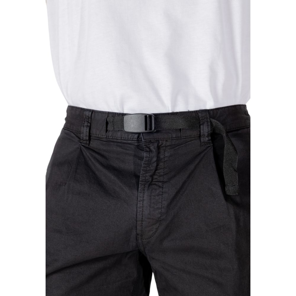 Close-up of Hugo Boss Black Cotton Bermuda Shorts showcasing belt detail and comfortable fit with white shirt.