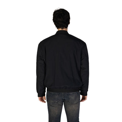 Back view of model wearing Hugo Boss Black Polyamide Bomber jacket, showcasing modern design and durable material.