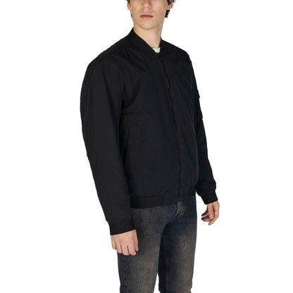 Man wearing Hugo Boss Black Polyamide Bomber jacket with ribbed collar and front zip closure.