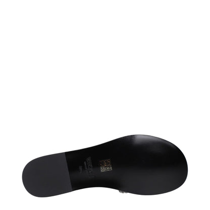 Sole view of Versace Black Leather Slippers with patent finish and logo, showcasing design details.
