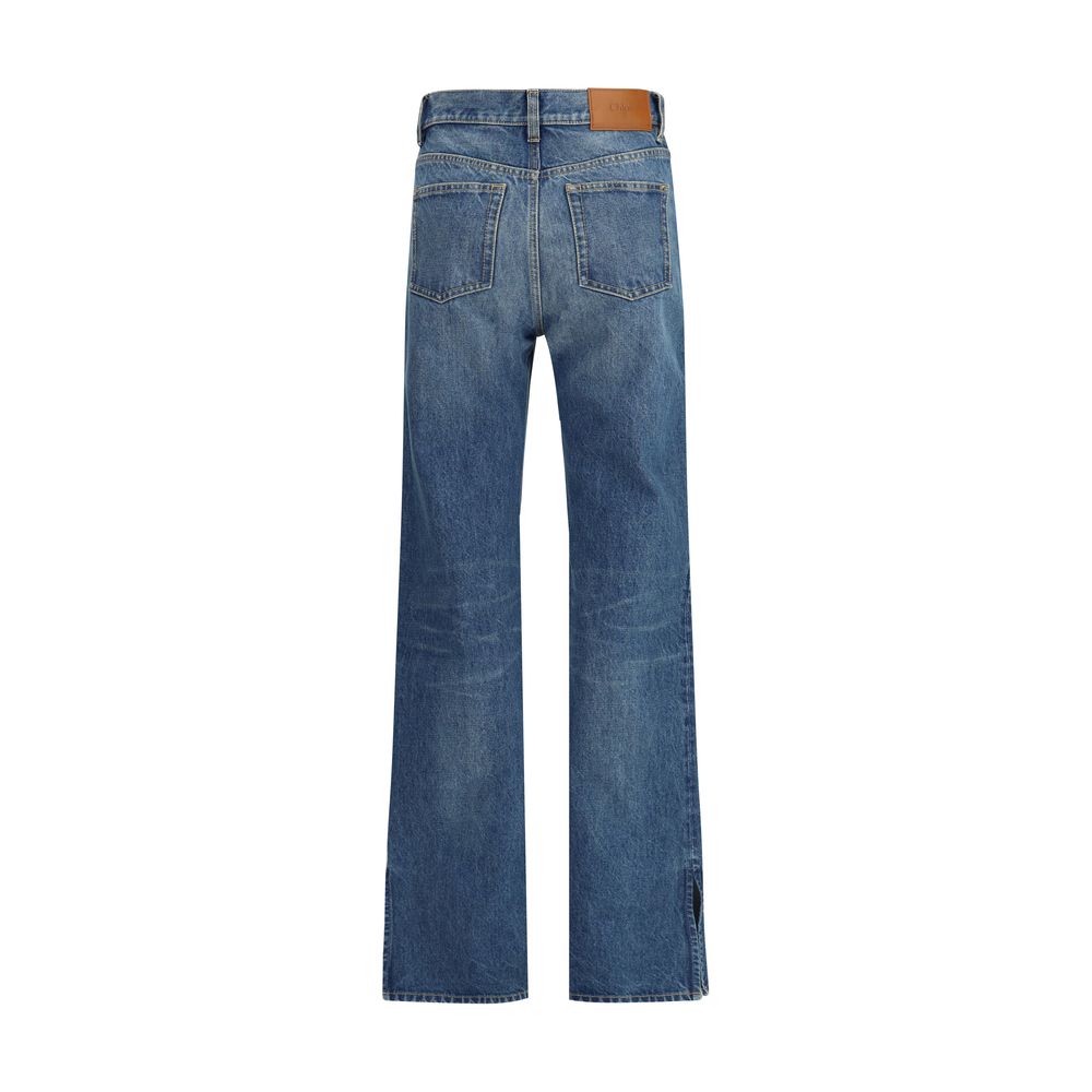 Back view of Chloé Blue Cotton Straight-Leg Jeans with leather patch and slit hem.