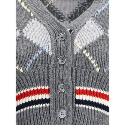 Close-up of Thom Browne Gray Fleece Wool Cardigan showcasing argyle pattern and button detail.