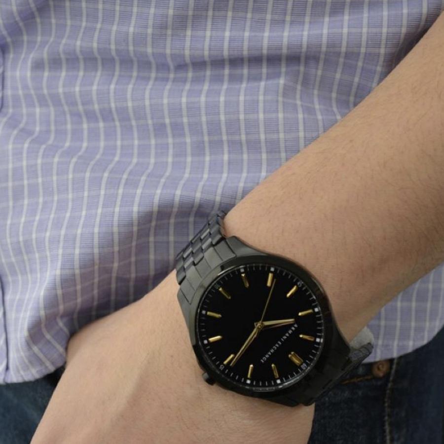 Gent wearing ARMANI EXCHANGE Mod. AX2144 wristwatch with stainless steel bracelet and mineral dial, showcasing elegant design.